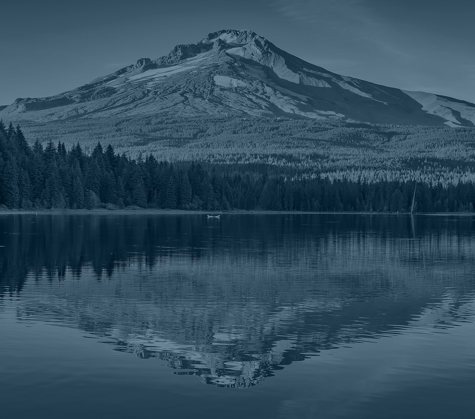 Mountain reflection in serene lake landscape.