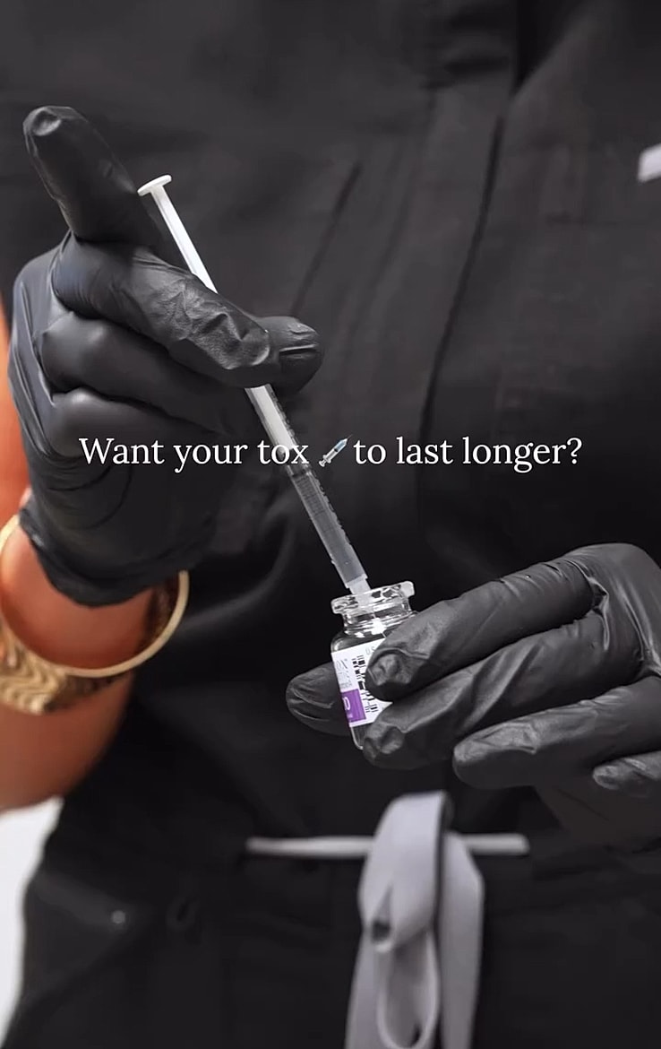 Person preparing a syringe with cosmetic treatment.
