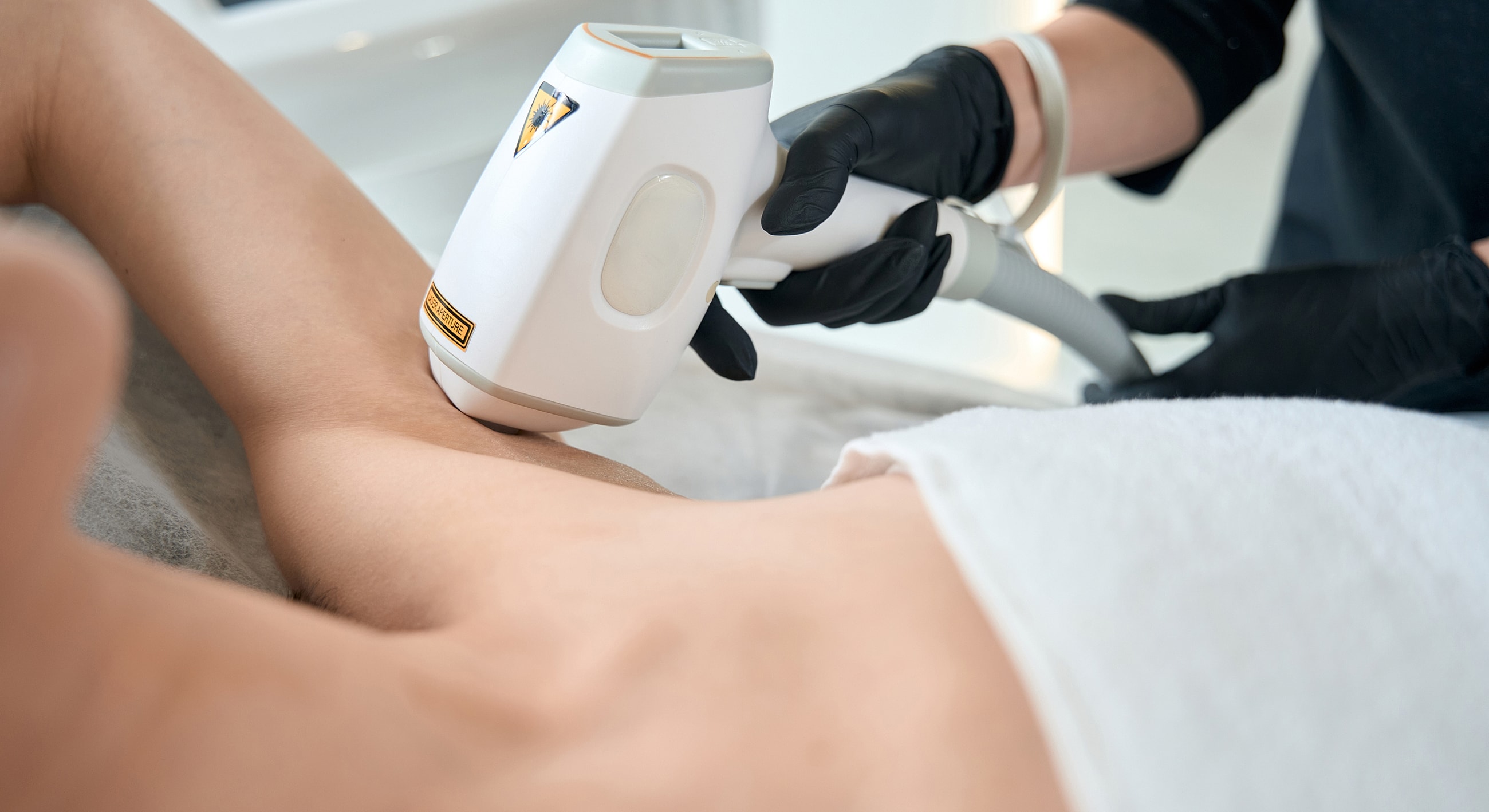 Woman with long hair and thoughtful expression.